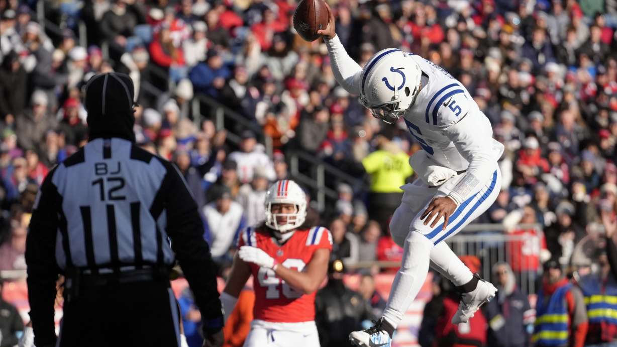 Indianapolis Colts quarterback Anthony Richardson (5) spikes the ball after his touchdown run during the first half of an NFL football game against the New England Patriots, Sunday, Dec. 1, 2024, in Foxborough, Mass.
