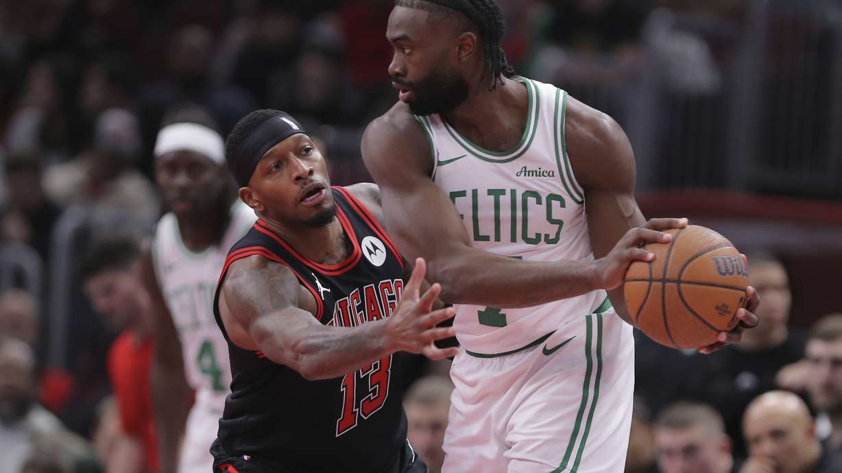 Chicago Bulls forward Torrey Craig defends against Boston Celtics guard Jaylen Brown during the first half of an Emirates NBA Cup basketball game, Friday Nov. 29, 2024, in Chicago.