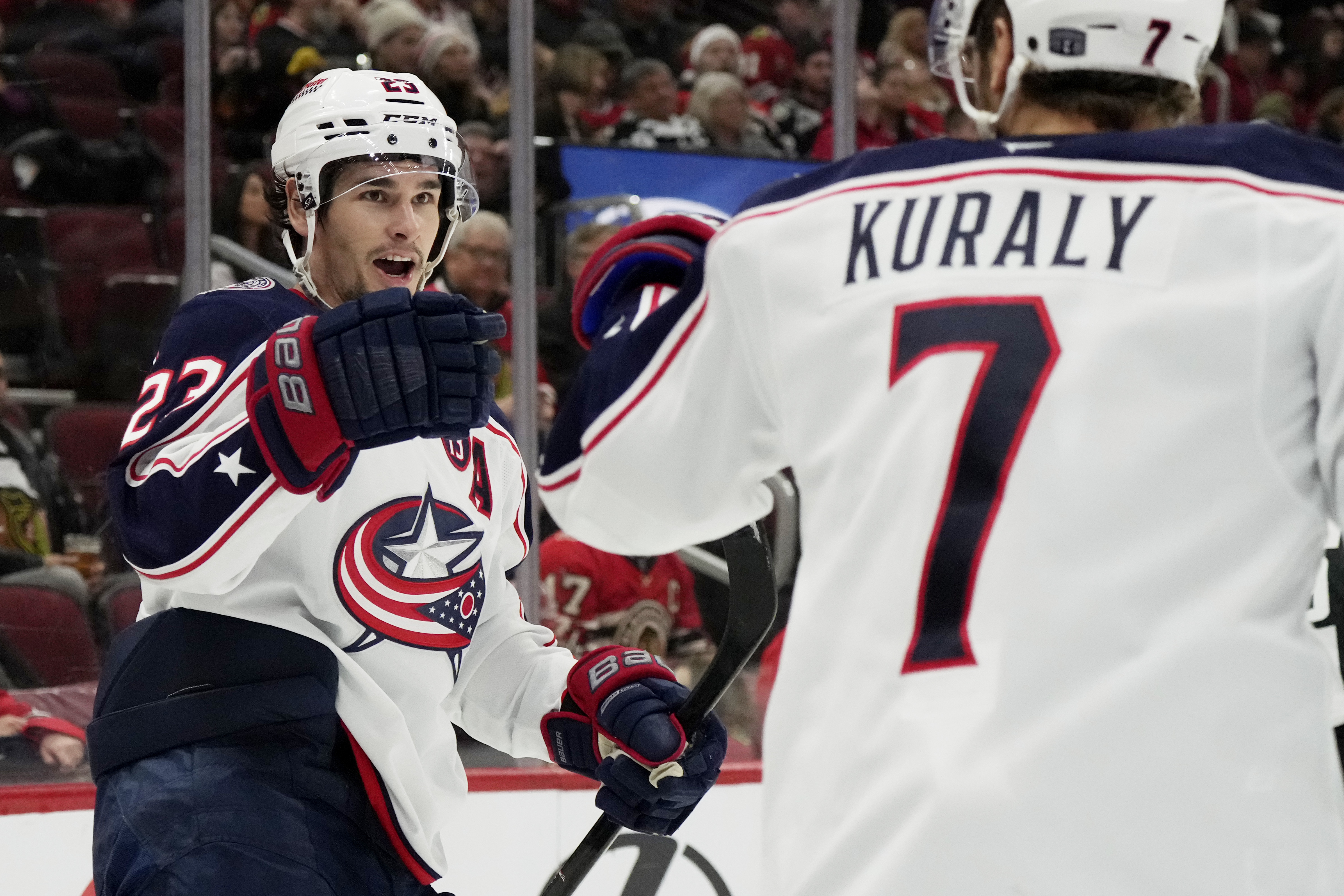 Columbus Blue Jackets center Sean Monahan, left, celebrates with center Sean Kuraly (7) after scoring during the second period of an NHL hockey game against the Chicago Blackhawks in Chicago, Sunday, Dec.1, 2024.