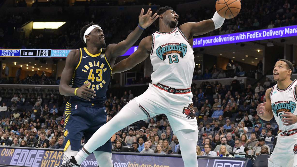 Memphis Grizzlies forward Jaren Jackson Jr. (13) grabs a rebound against Indiana Pacers forward Pascal Siakam (43) in the first half of an NBA basketball game Sunday, Dec. 1, 2024, in Memphis, Tenn.