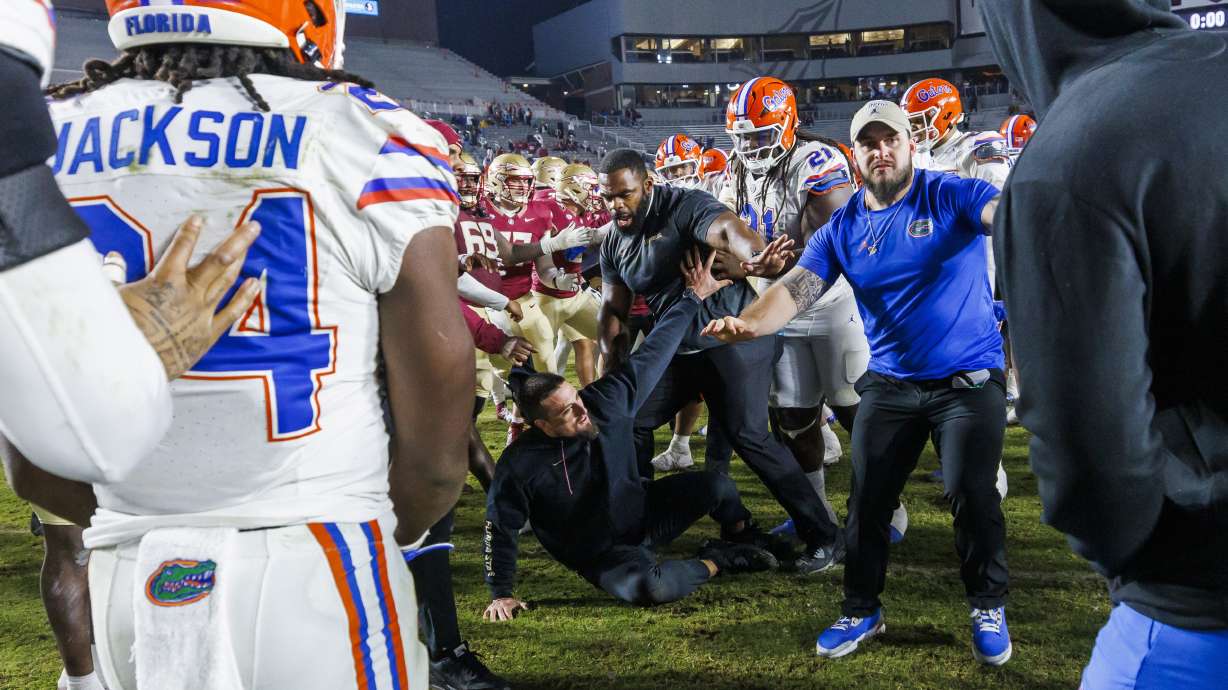 Florida State and Florida players scuffle at midfield after an NCAA college football game Saturday, Nov. 30, 2024, in Tallahassee, Fla.