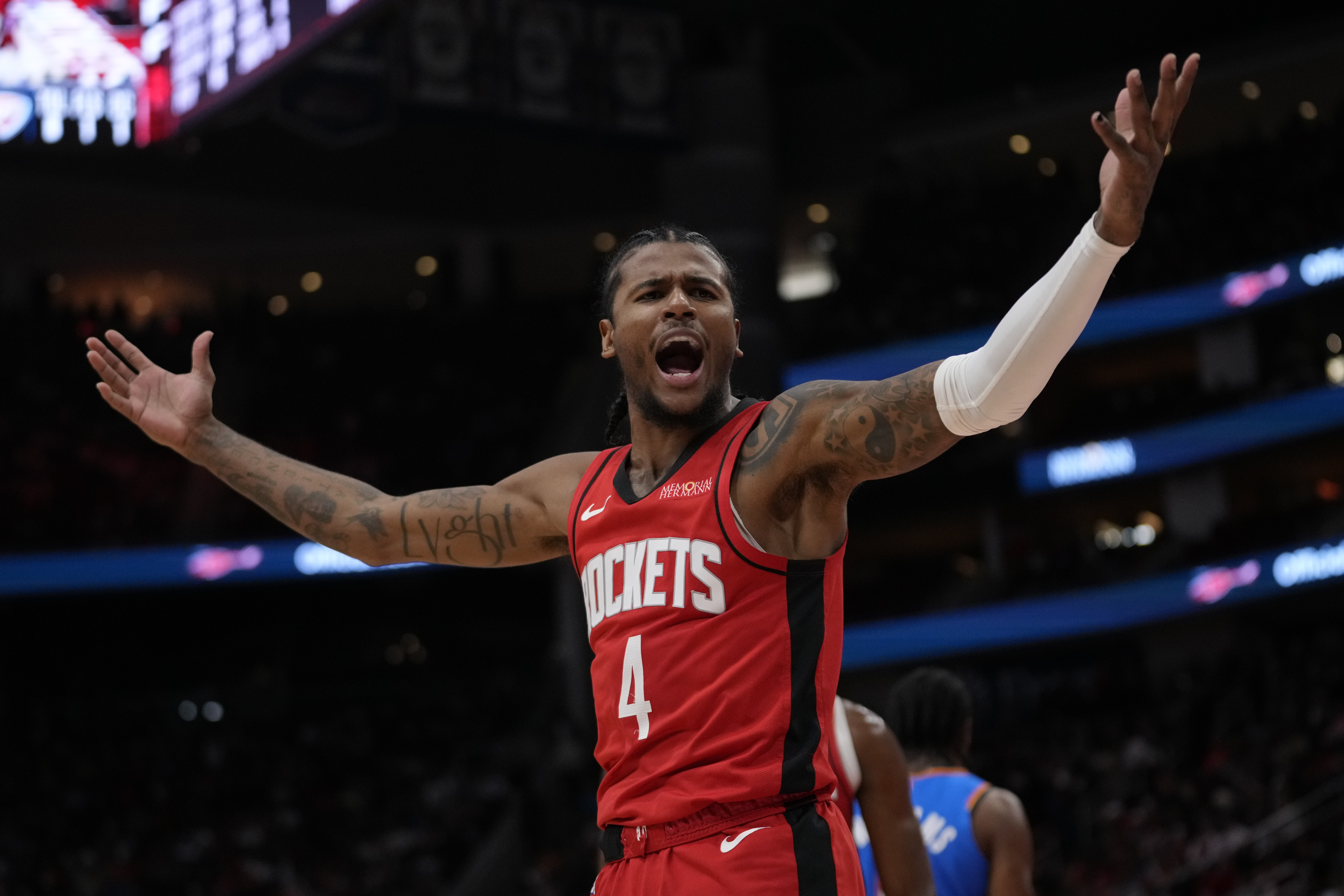 Houston Rockets guard Jalen Green celebrates after scoring during the first half of an NBA basketball game against the Oklahoma City Thunder in Houston, Sunday, Dec. 1, 2024.