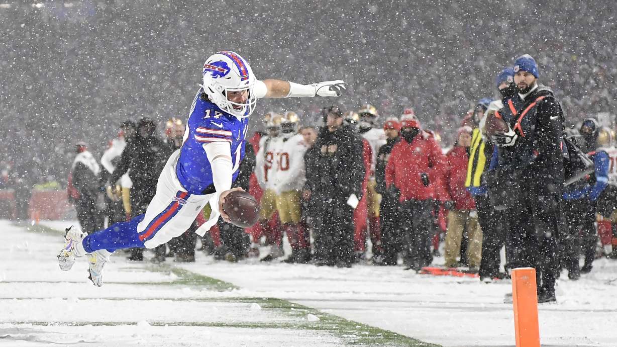 Buffalo Bills quarterback Josh Allen (17) dives for the end zone to score against the San Francisco 49ers during the second half of an NFL football game in Orchard Park, N.Y., Sunday, Dec. 1, 2024.
