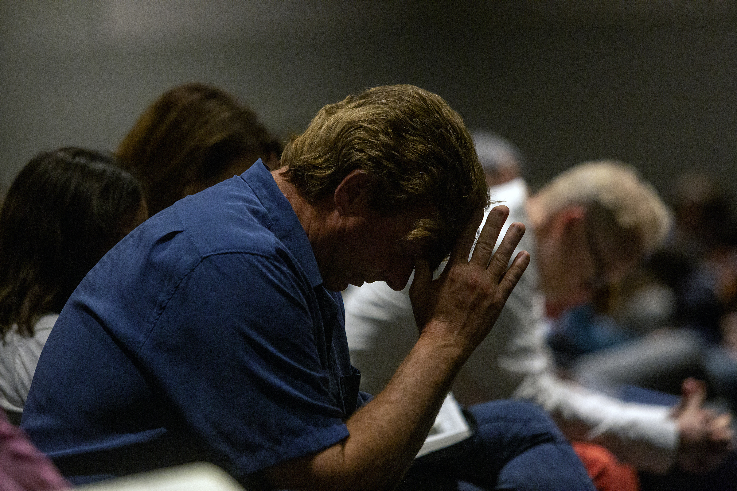 A man prays during a church service at Kingsland Baptist Church in Katy on Sunday, March 28, 2021.