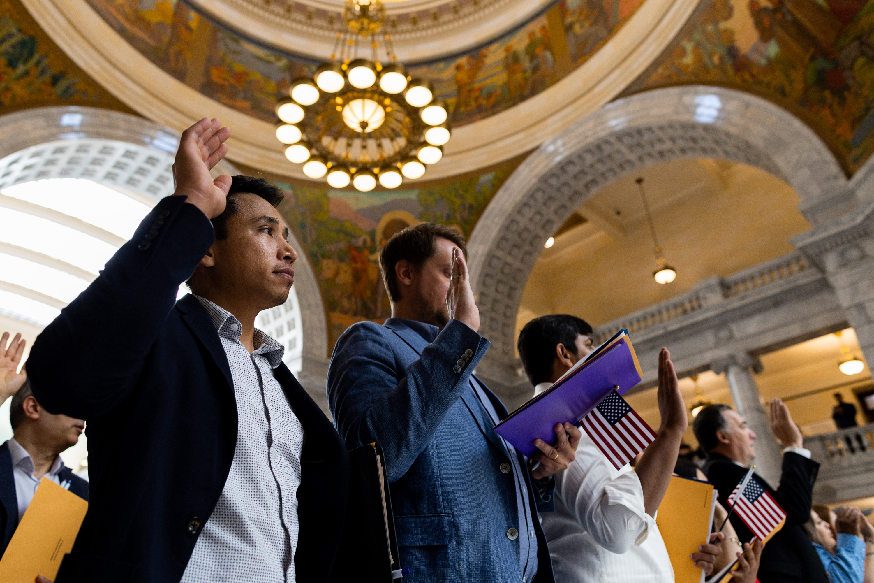 A naturalization ceremony at the Utah Capitol in Salt Lake City on June 20. A new report shows most Americans favor a means of allowing immigrants already in the country illegally to remain under certain circumstances. 