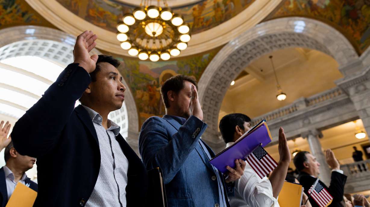 A naturalization ceremony at the state Capitol in Salt Lake City on June 20. A new report shows most Americans favor a means of allowing immigrants already in the country illegally to remain under certain circumstances.