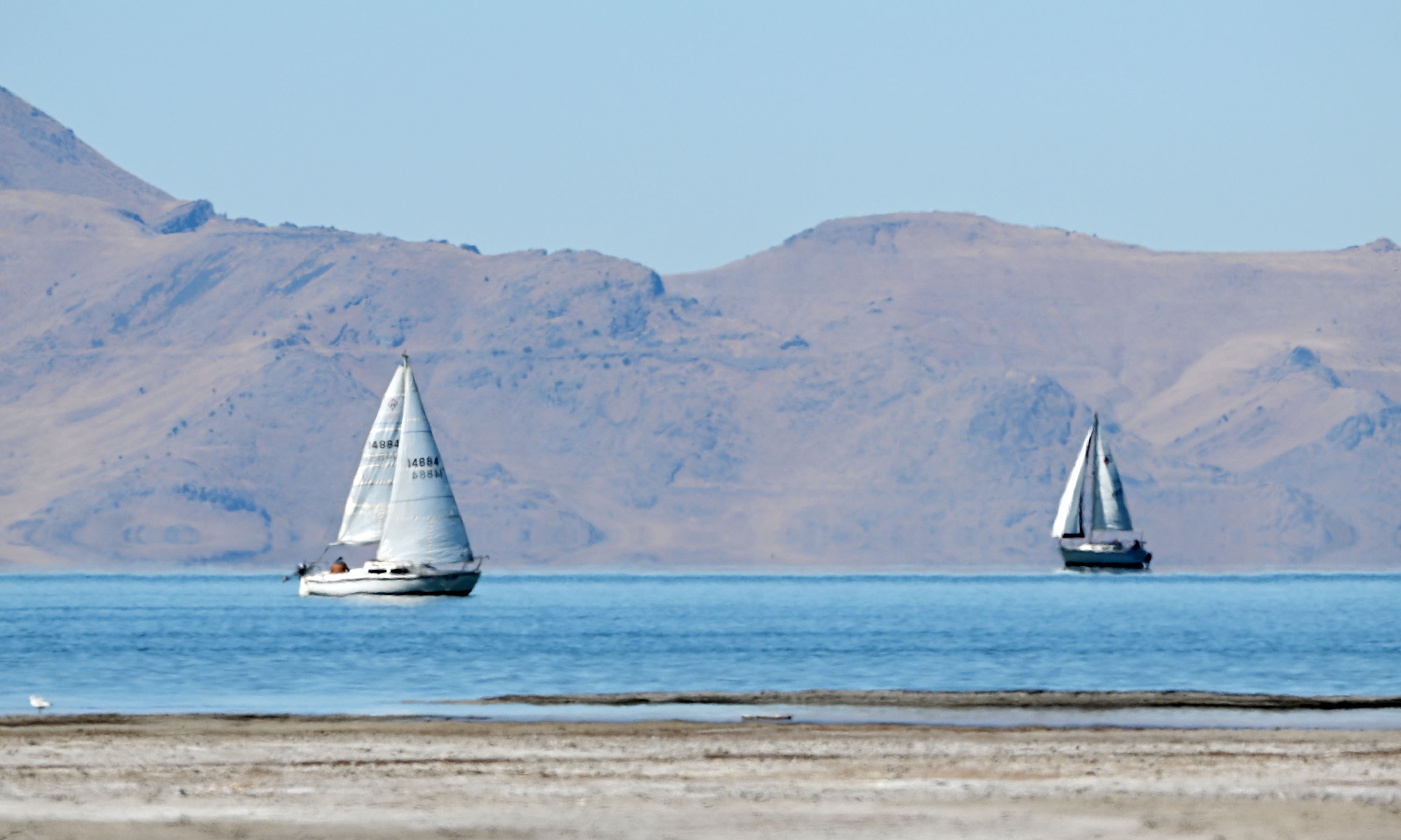 Two sailboats move across the water at the Great Salt Lake, near Magna, on Sept. 24. The U.S. Bureau of Reclamation has announced it will send Utah $50 million to be used on lake preservation projects.