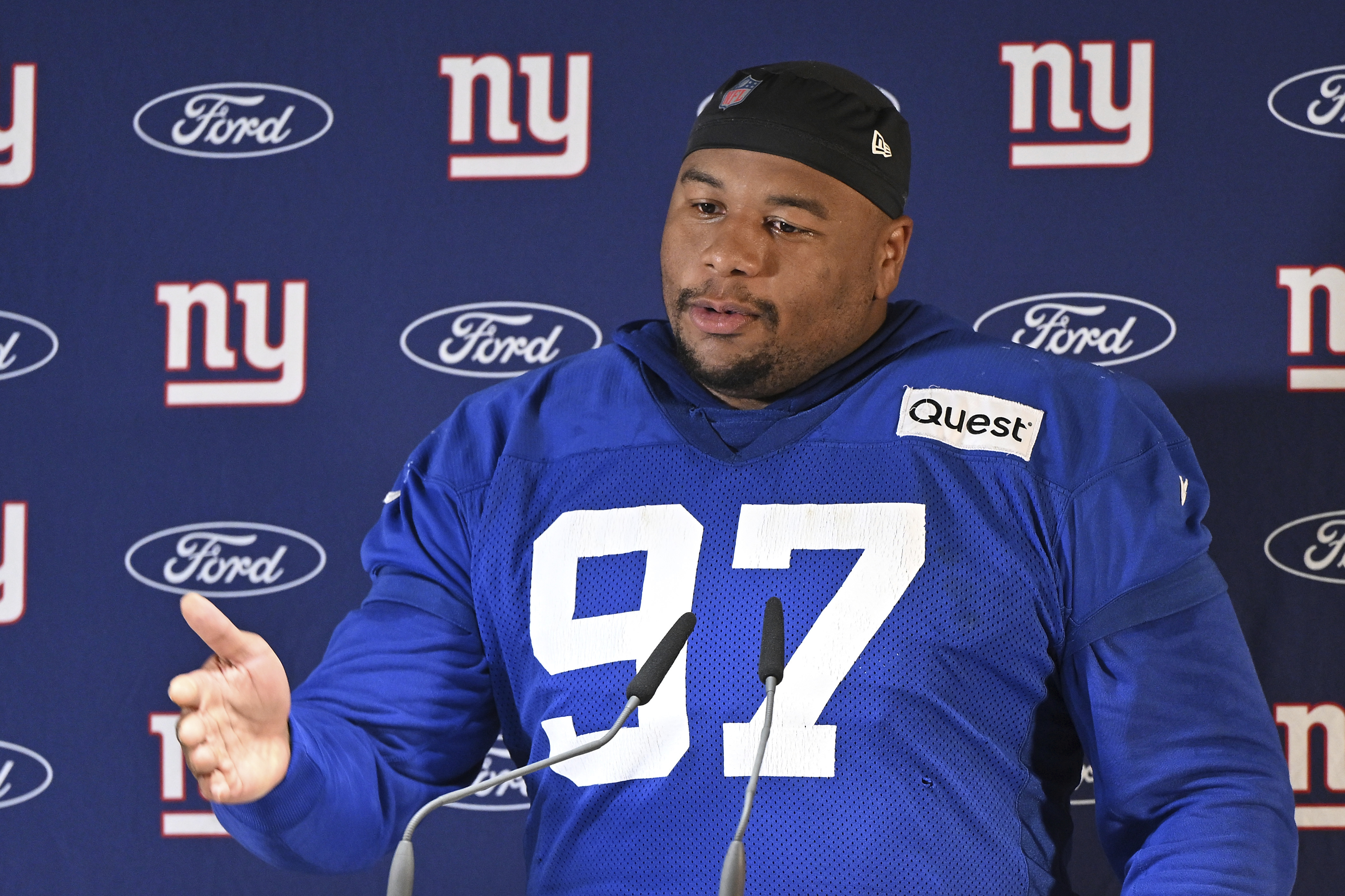 New York Giants defensive tackle Dexter Lawrence II (97) attends a news conference after a practice session in Munich, Germany, Friday, Nov. 8, 2024. The New York Giants are set to play the Carolina Panthers in an NFL game at the Allianz Arena in Munich on Sunday.