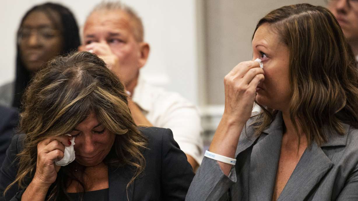 Lisa Miller, left, and her daughter, Mandi Jenkins, wipe tears from their eyes after a bond hearing for Jamie Lee Komoroski, Aug 1, 2023, at the Charleston County Courthouse in Charleston, South Carolina. Komoroski pleaded guilty Monday to reckless homicide and DUI charges.