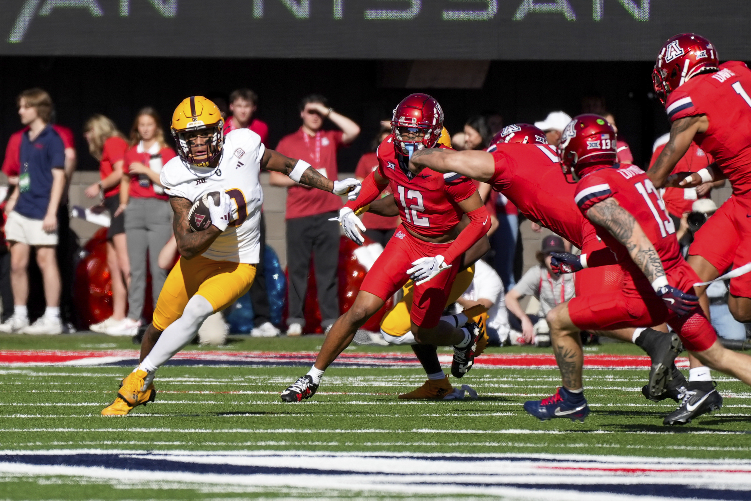 Arizona State wide receiver Jordyn Tyson (0) runs with the ball during the first half of an NCAA college football game against Arizona, Saturday, Nov. 30, 2024, in Tucson, Ariz.