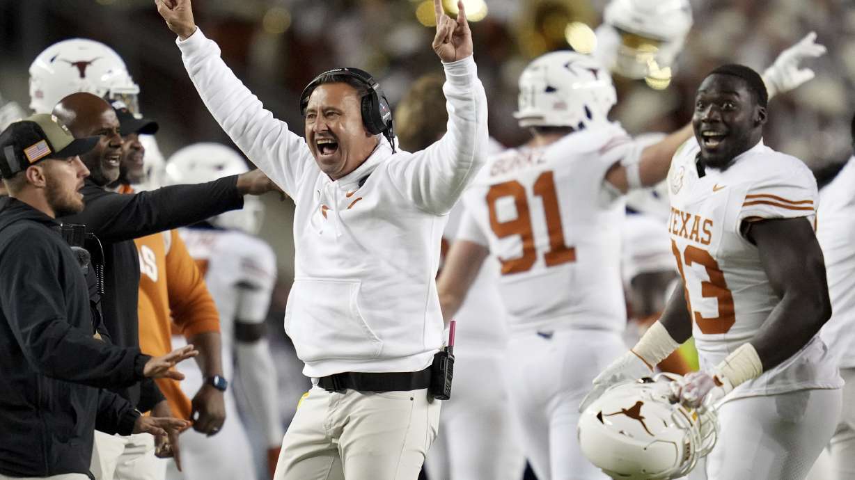 Texas head coach Steve Sarkisian, center left, reacts as his team recovers a fumble late in the fourth quarter of an NCAA college football game against Texas A&M, Saturday, Nov. 30, 2024, in College Station, Texas.