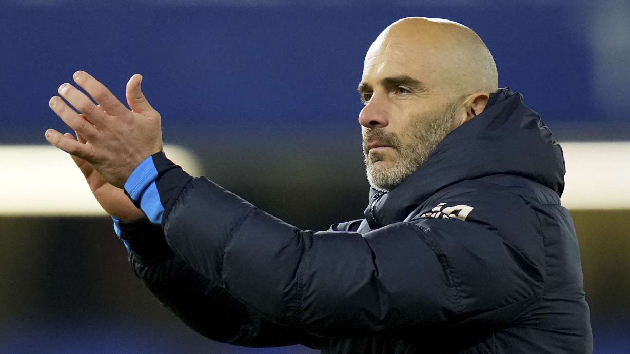 Chelsea's head coach Enzo Maresca applauds at the end of the English Premier League soccer match between Chelsea and Arsenal at Stamford Bridge stadium in London, Sunday, Nov. 10, 2021.