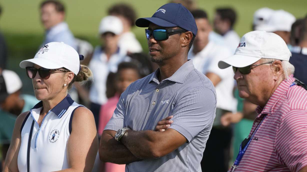 FILE - Tiger Woods watches his son Charlie Woods during the second round of stroke play at the U.S. Junior Amateur Golf Championship on July 23, 2024, in Bloomfield Township, Mich.
