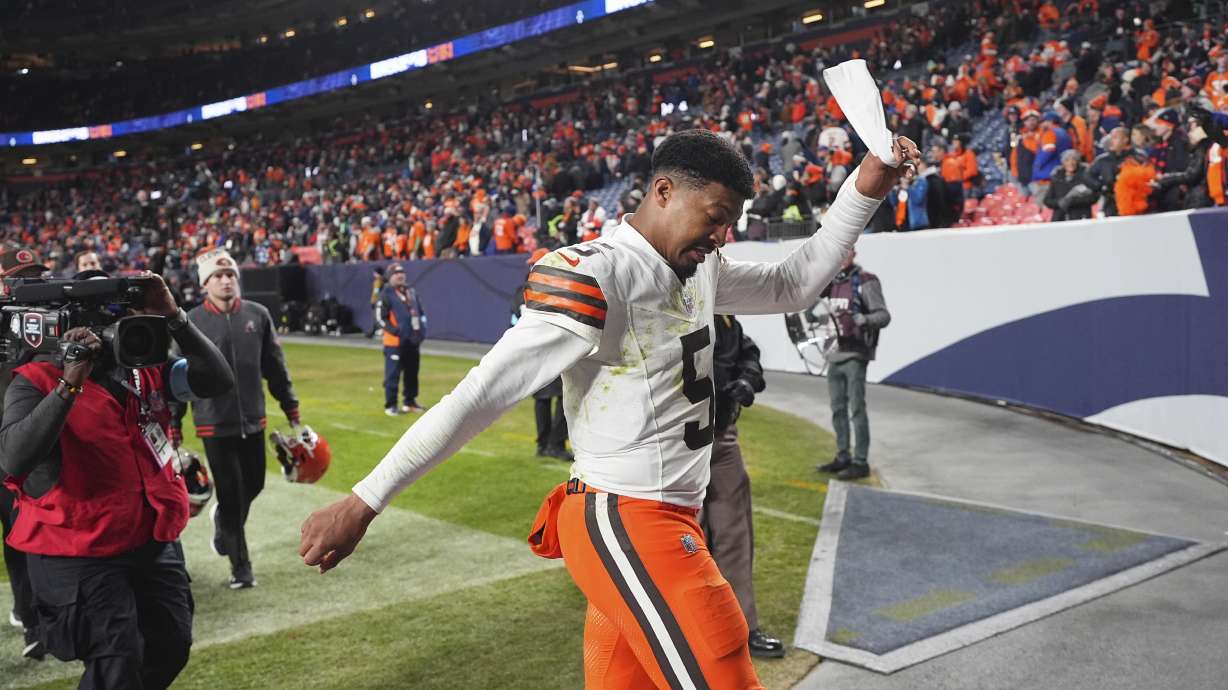 Cleveland Browns quarterback Jameis Winston pulls off his headband while heading into the locker room after an NFL football game against the Denver Broncos Monday, Dec. 2, 2024, in Denver.