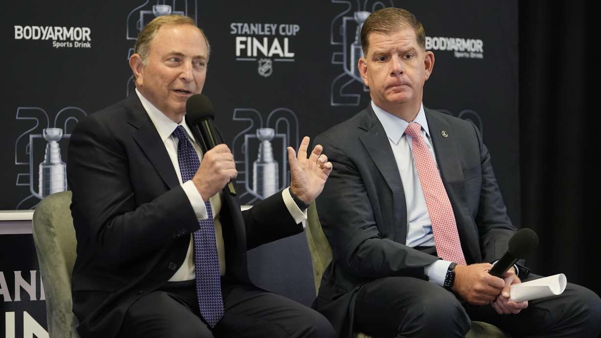 FILE - NHL Commissioner Gary Bettman, left, speaks before Game 1 of the NHL hockey Stanley Cup Finals between the Florida Panthers and the Edmonton Oilers, June 8, 2024, in Sunrise, Fla. At right is NHL Players Association Director Marty Walsh.