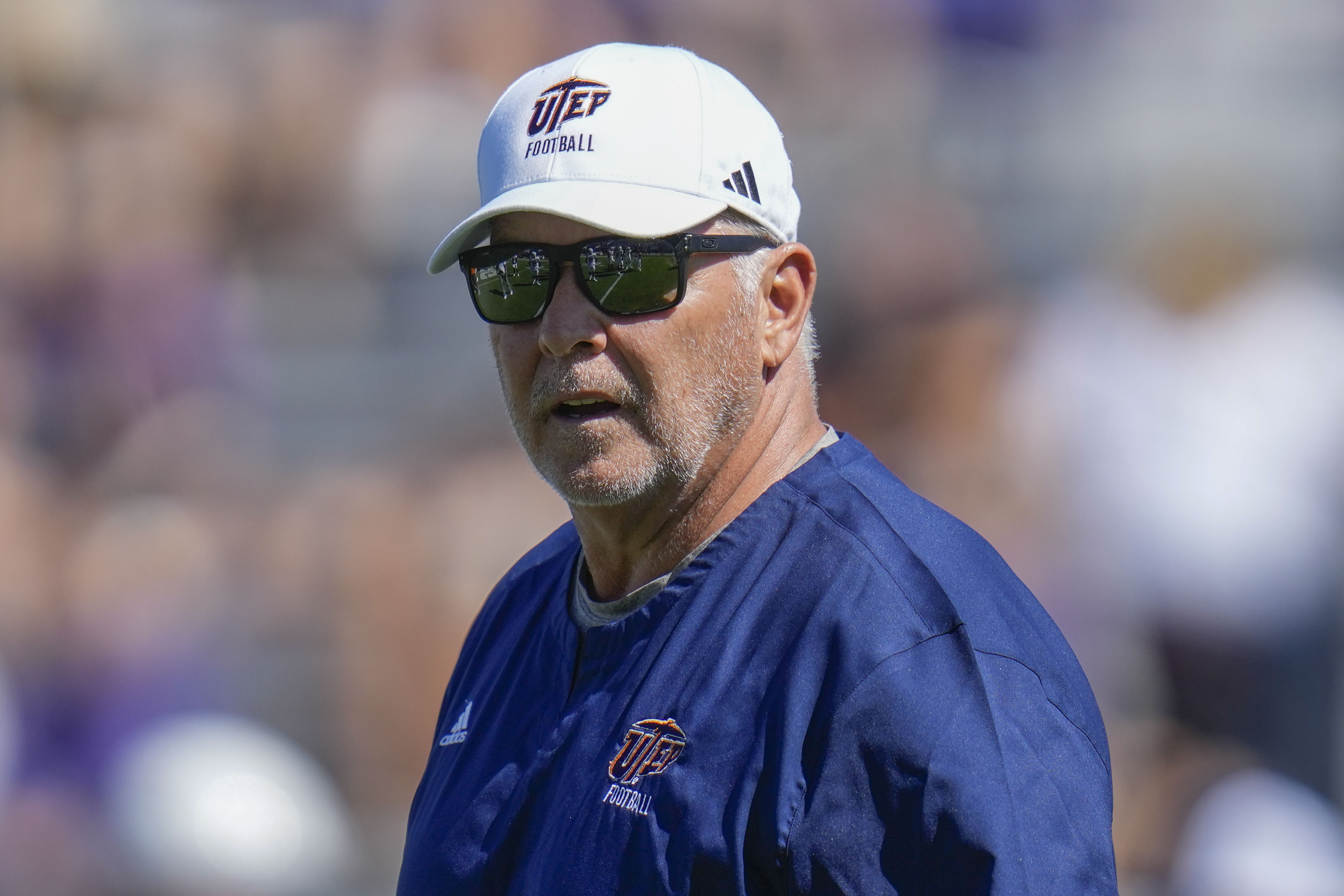 FILE - UTEP head coach Dana Dimel walks the field during warmups before an NCAA college football game against Northwestern, on Sept. 9, 2023, in Evanston, Ill.