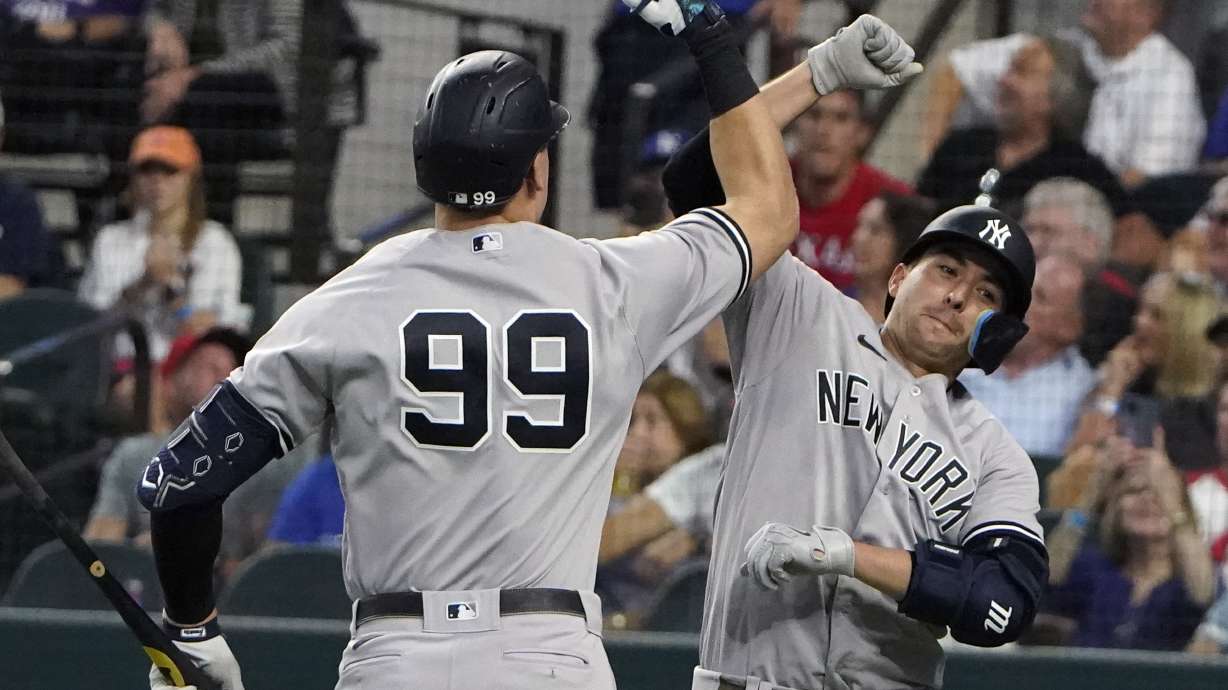 FILE - New York Yankees Kyle Higashioka, right, celebrates his solo home run with teammate Aaron Judge during the eighth inning in the first baseball game of a doubleheader against the Texas Rangers in Arlington, Texas, Tuesday, Oct. 4, 2022.