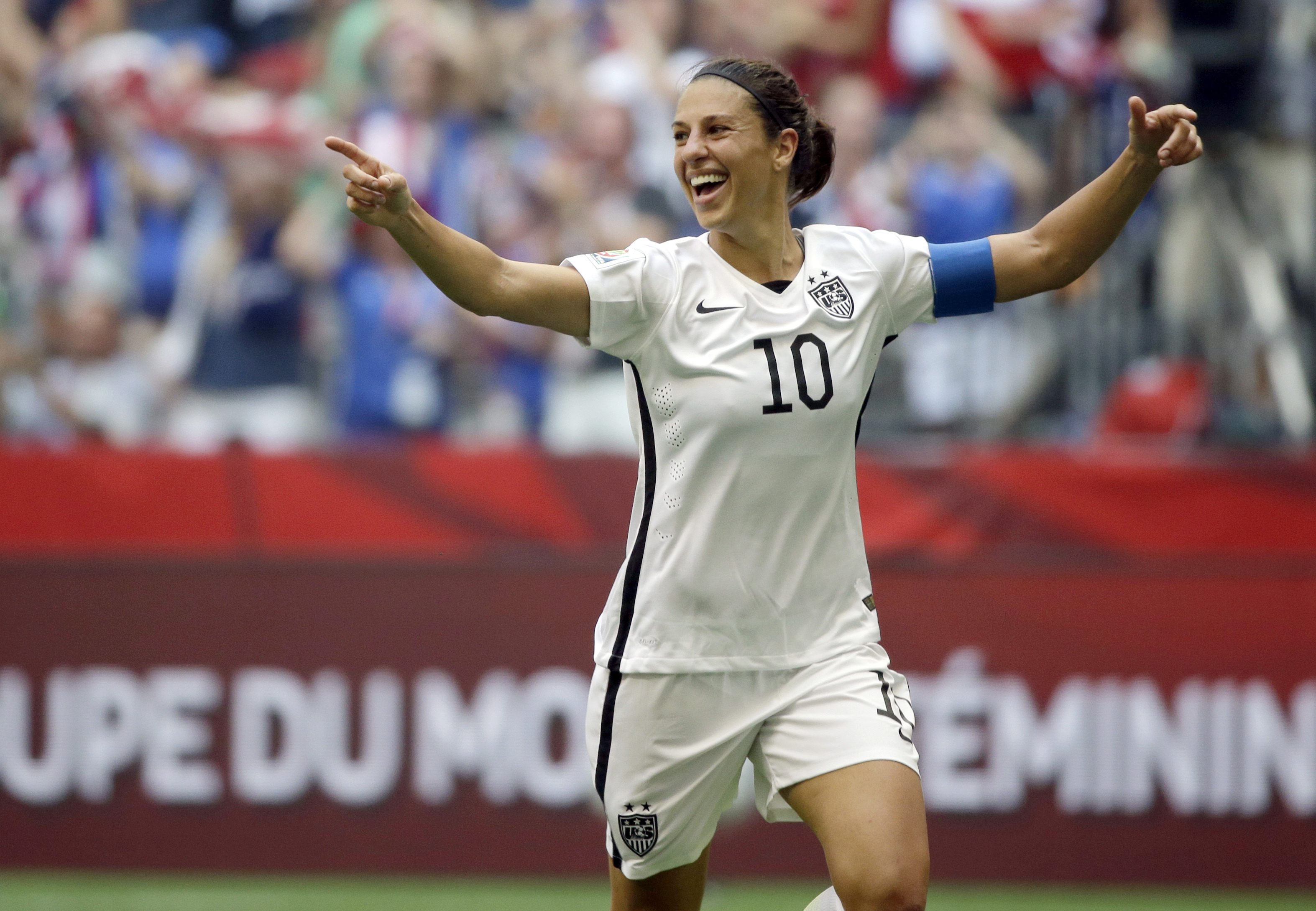 FILE - In this July 5, 2015, file photo, Carli Lloyd of the U.S celebrates scoring her third goal against Japan during the first half of the FIFA Women's World Cup soccer championship in Vancouver, British Columbia, Canada. 