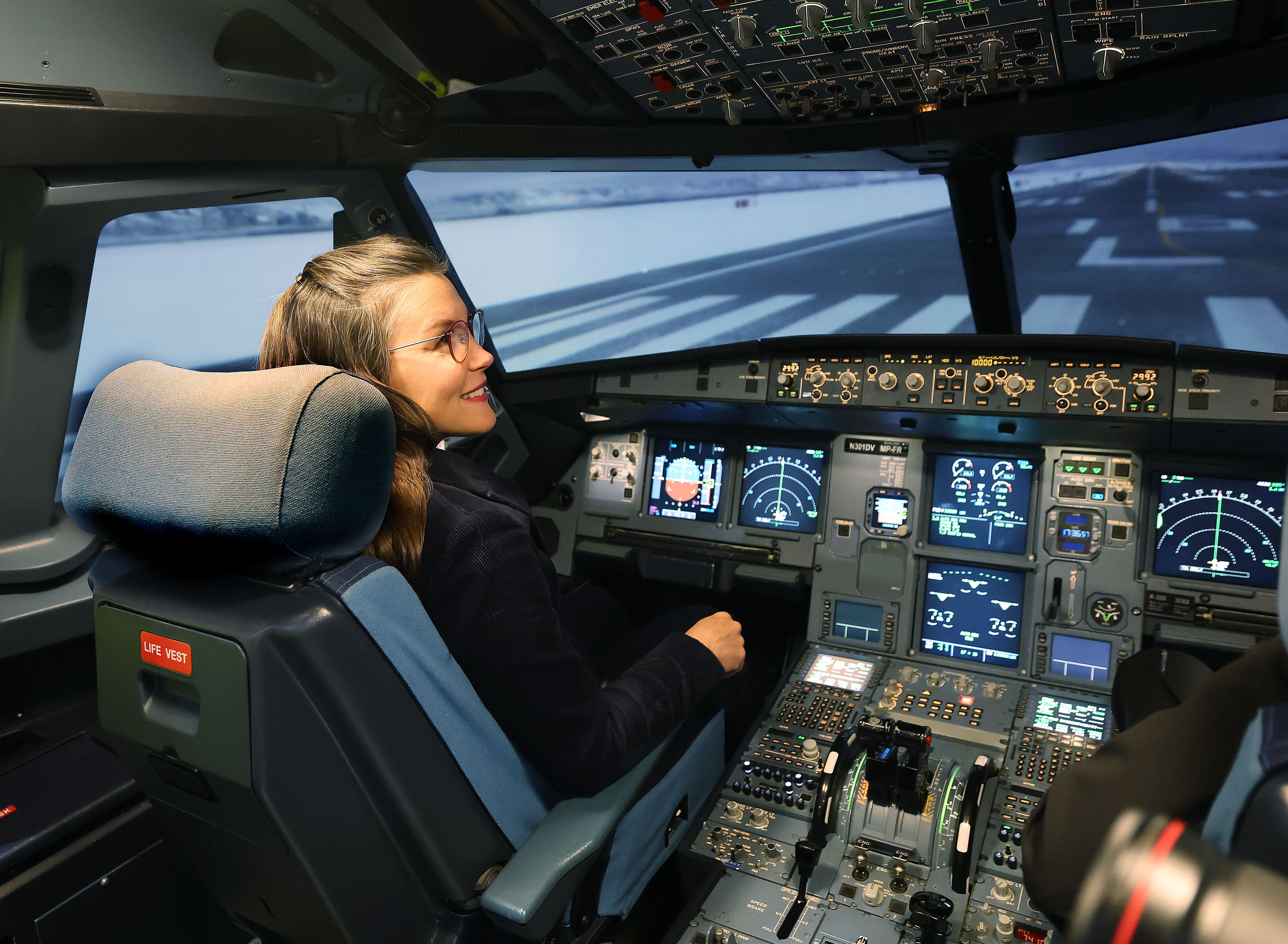 Salt Lake City Mayor Erin Mendenhall flies an Airbus 320 simulator at a ribbon-cutting ceremony for Delta Air Lines’ new Salt Lake City Flight Operations Training Facility on Tuesday.