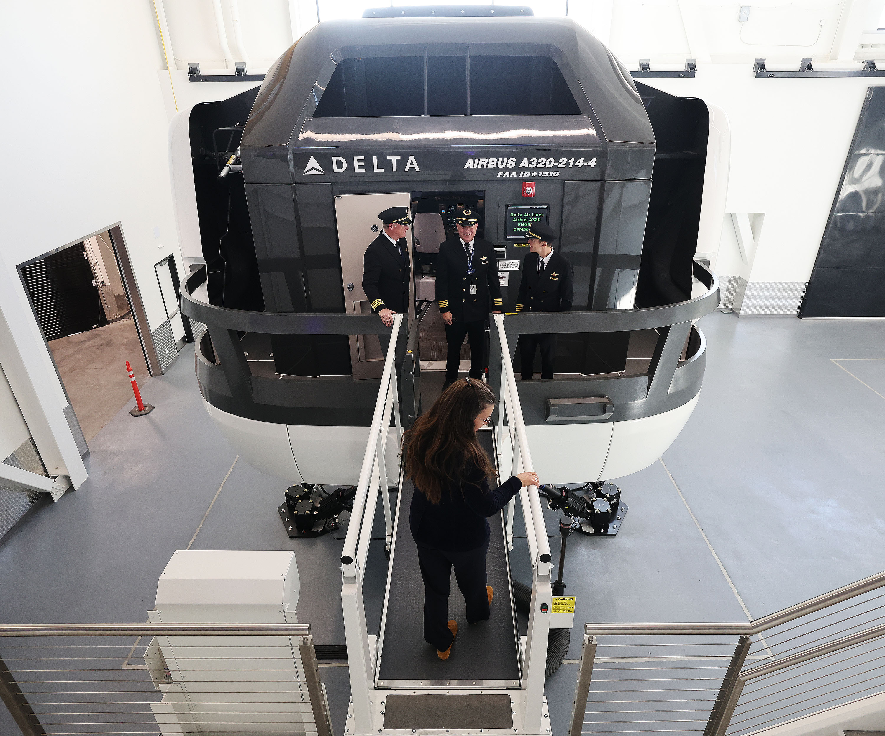 Salt Lake City Mayor Erin Mendenhall talks to Delta pilots after flying in an Airbus 320 simulator at a ribbon-cutting ceremony for Delta Air Lines’ new Flight Operations Training Facility in Salt Lake City on Tuesday.