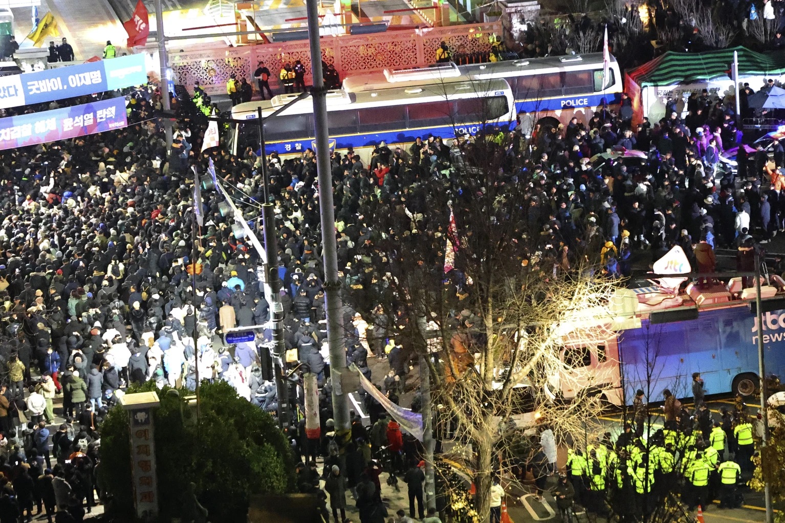 People gather to demand South Korean President Yoon Suk Yeol step down in front of the National Assembly in Seoul, South Korea, Wednesday.