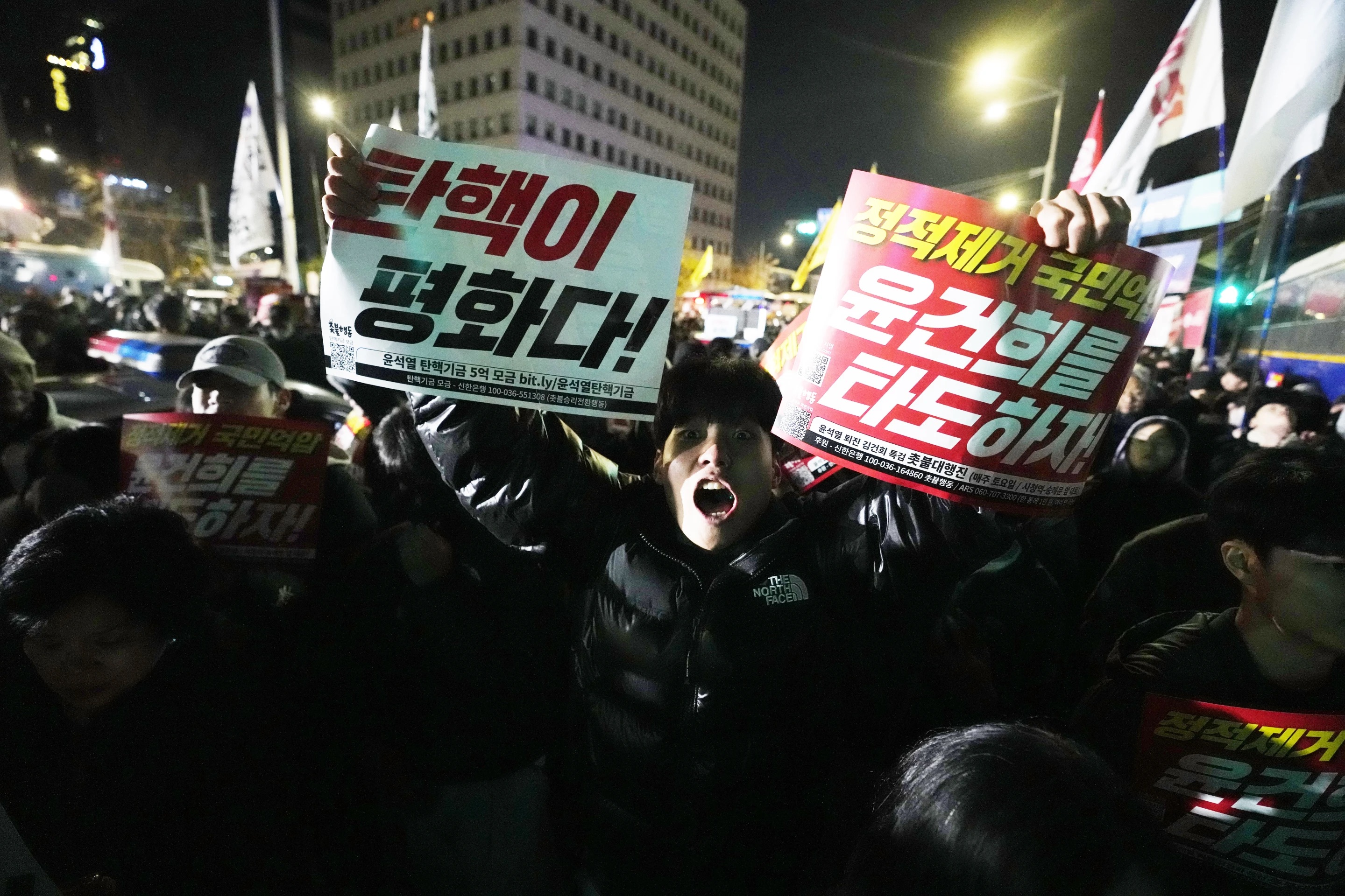 A man shouts to demand South Korean President Yoon Suk Yeol to step down in front of the National Assembly in Seoul, South Korea, Wednesday.