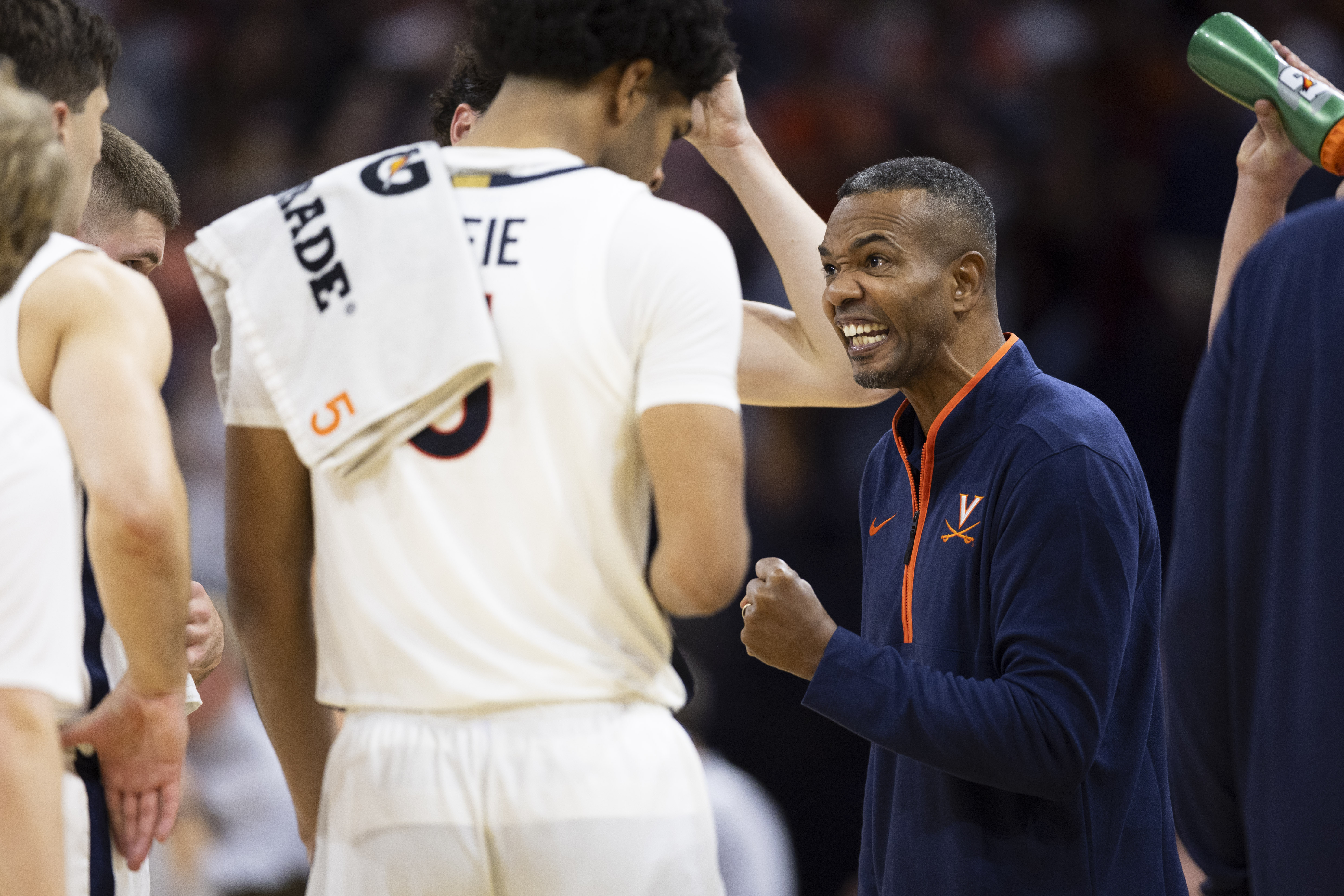 Virginia interim head coach Ron Sanchez speaks to forward Jacob Cofie (5) during the second half of an NCAA college basketball game against Campbell, Wednesday, Nov. 6, 2024, in Charlottesville, Va.
