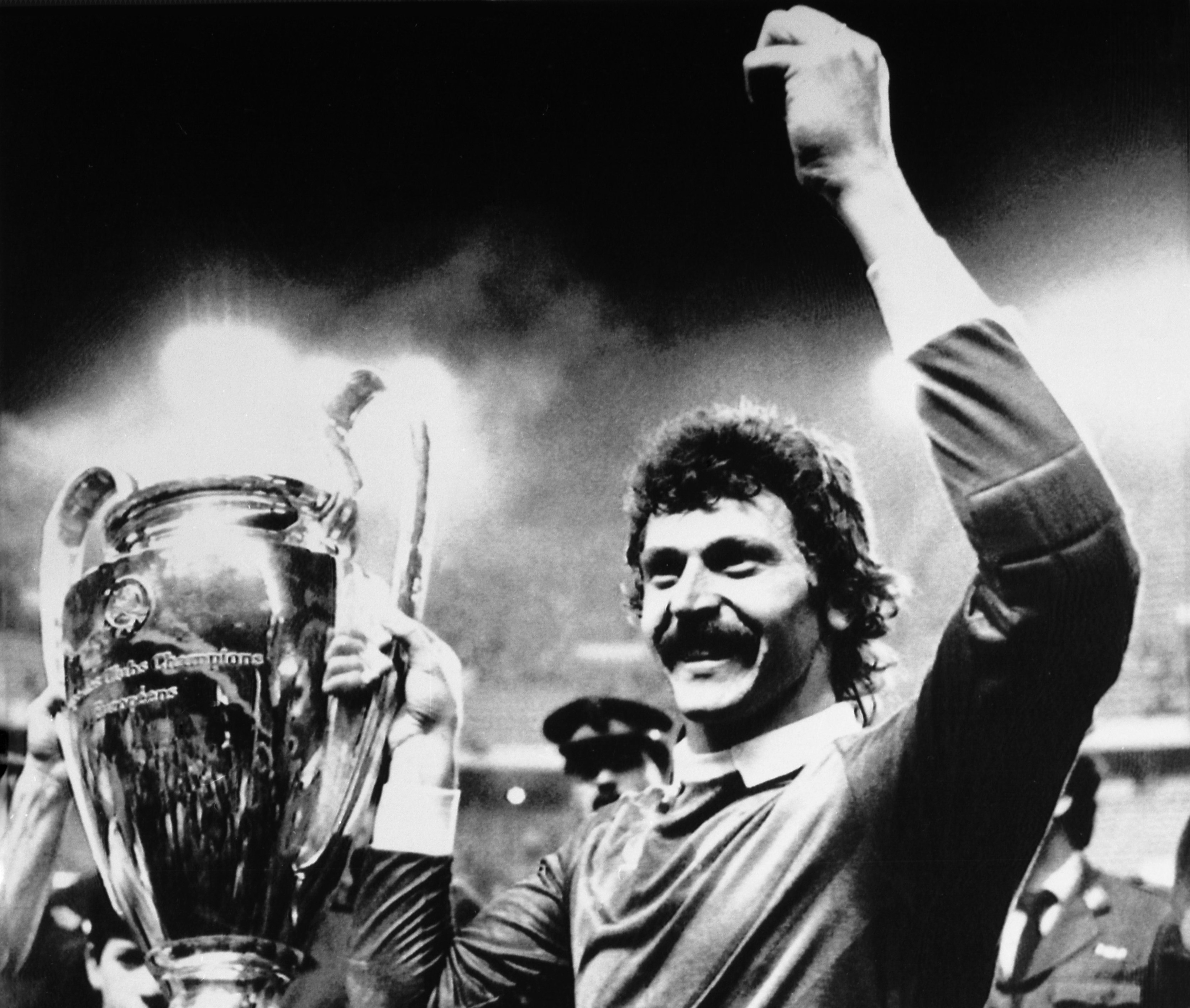 FILE - Steaua Bucharest goalkeeper Helmuth Duckadam raises the European Champions Cup after the Romainian team defeated Barcelona in penalties in Seville, Spain, May 7, 1986. Former Steaua Bucharest goalkeeper Helmuth Duckadam, who saved four penalties in the 1986 European Cup final shootout win against Barcelona, died on Monday. He was 65.