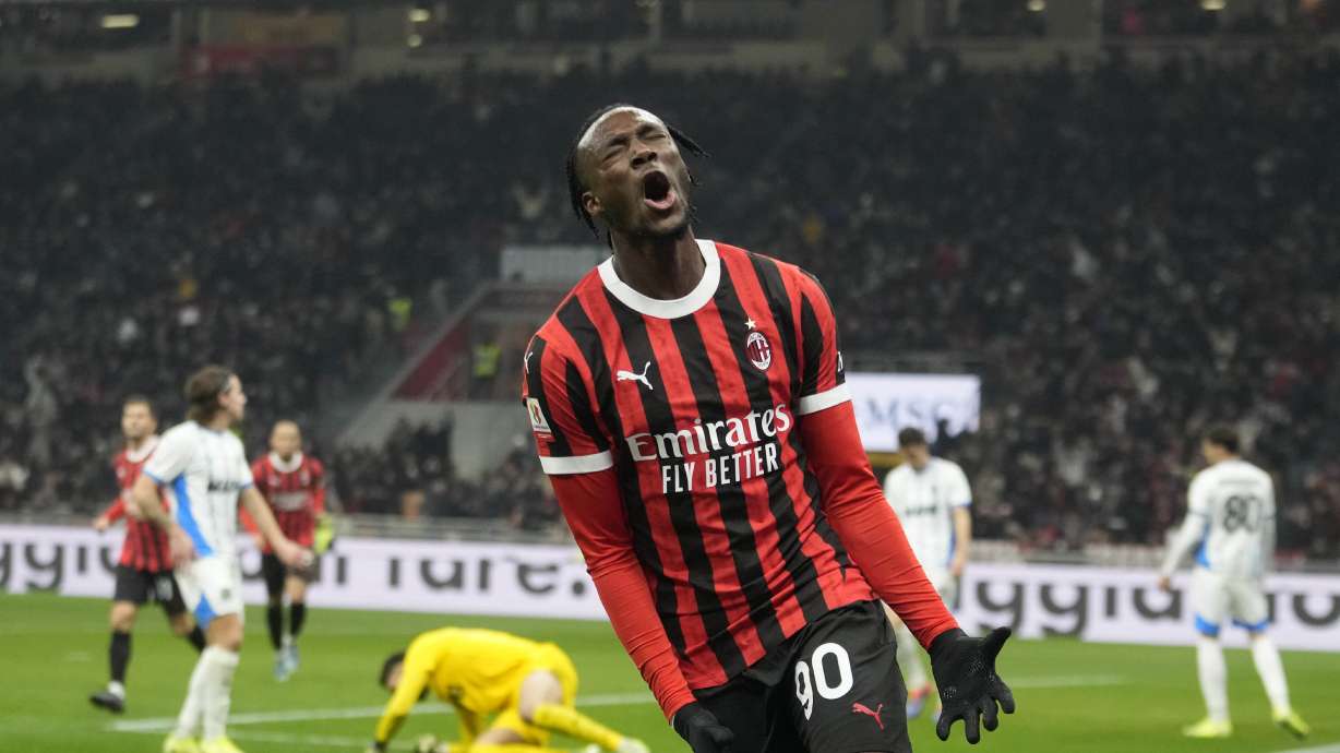 AC Milan's Tammy Abraham celebrates after scoring during the Italian Cup eight final soccer match between AC Milan and Sassuolo at the San Siro stadium in Milan, Italy, Tuesday, Dec. 3, 2024.