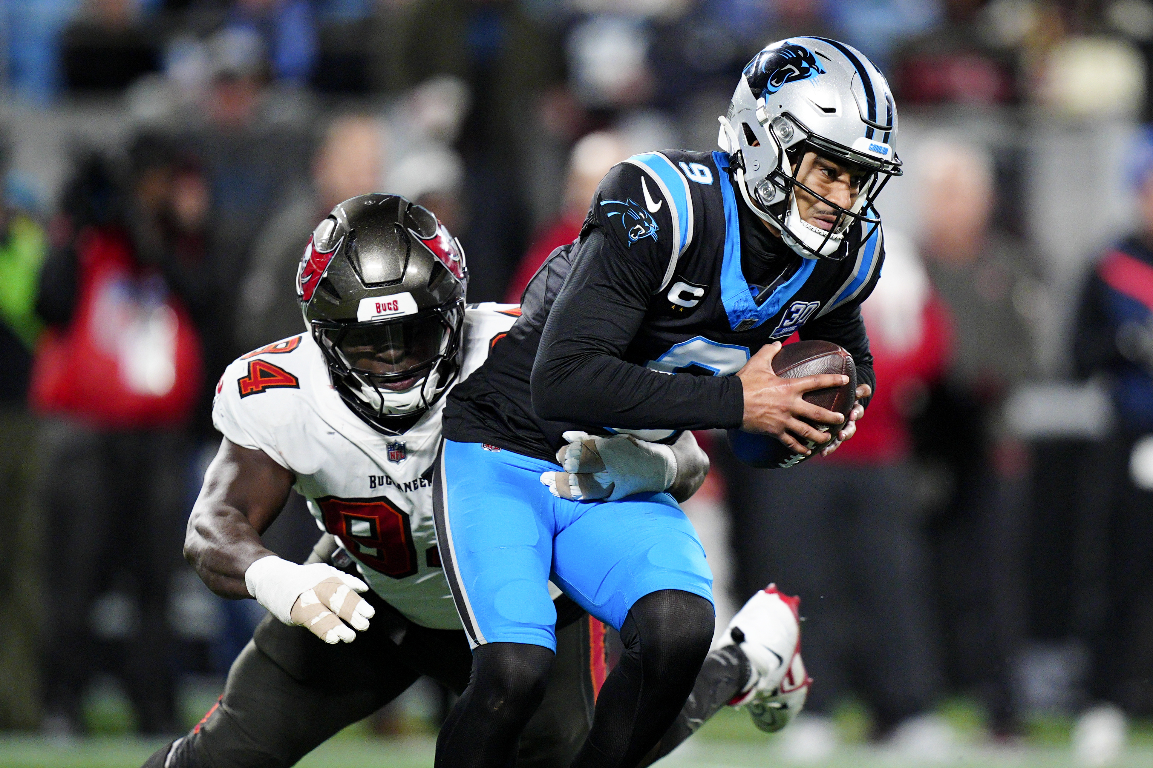 Carolina Panthers quarterback Bryce Young is sacked by Tampa Bay Buccaneers defensive tackle Calijah Kancey during the second half of an NFL football game, Sunday, Dec. 1, 2024, in Charlotte, N.C.