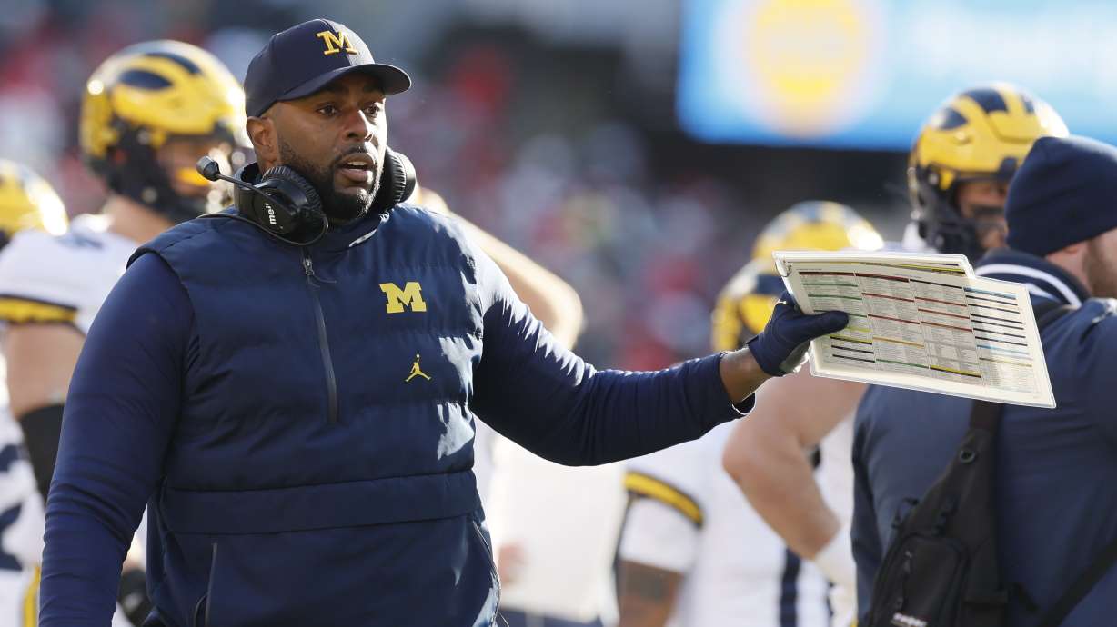 Michigan head coach head coach Sherrone Moore talks to his team during the second half of an NCAA college football game against Michigan Saturday, Nov. 30, 2024, in Columbus, Ohio.