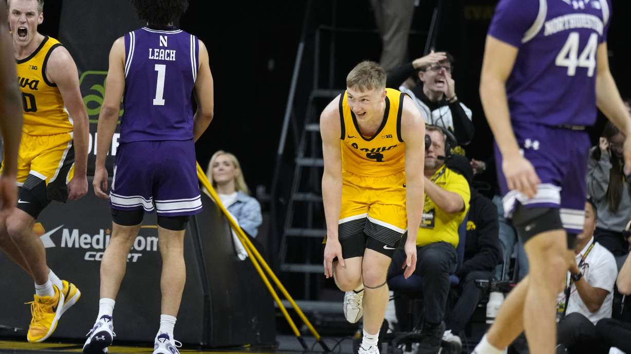 Iowa guard Josh Dix (4) celebrates after making a basket during the first half of an NCAA college basketball game against Northwestern, Tuesday, Dec. 3, 2024, in Iowa City, Iowa.