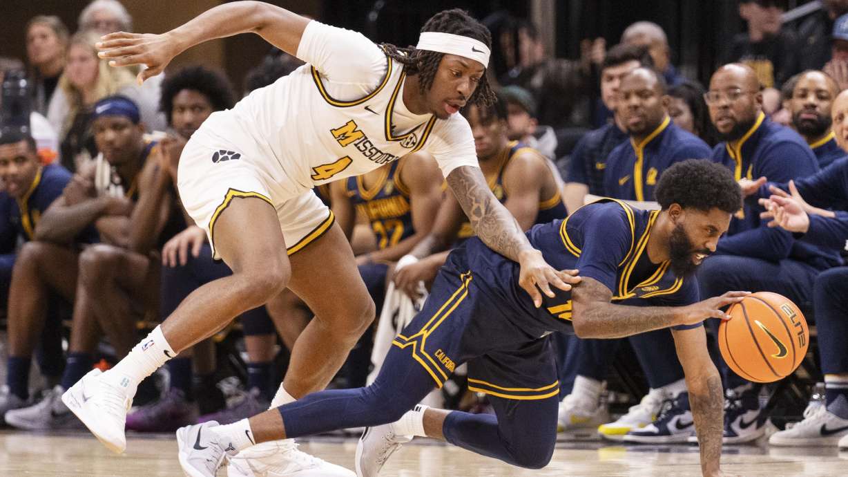California guard Jovan Blacksher Jr., right, and Missouri guard Marcus Allen, left, scramble for a loose ball during the second half of an NCAA college basketball game Tuesday, Dec. 3, 2024, in Columbia, Mo.