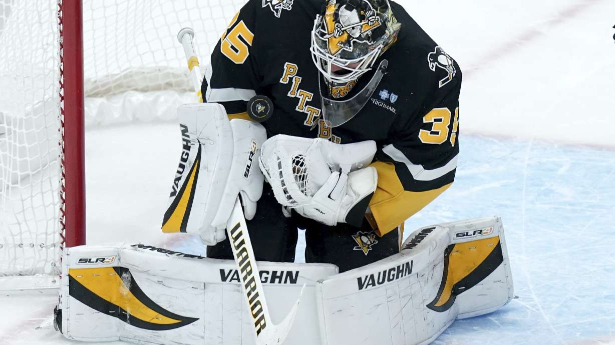 Pittsburgh Penguins goaltender Tristan Jarry (35) makes a save during the first period of an NHL hockey game against the Florida Panthers, Tuesday, Dec. 3, 2024, in Pittsburgh.