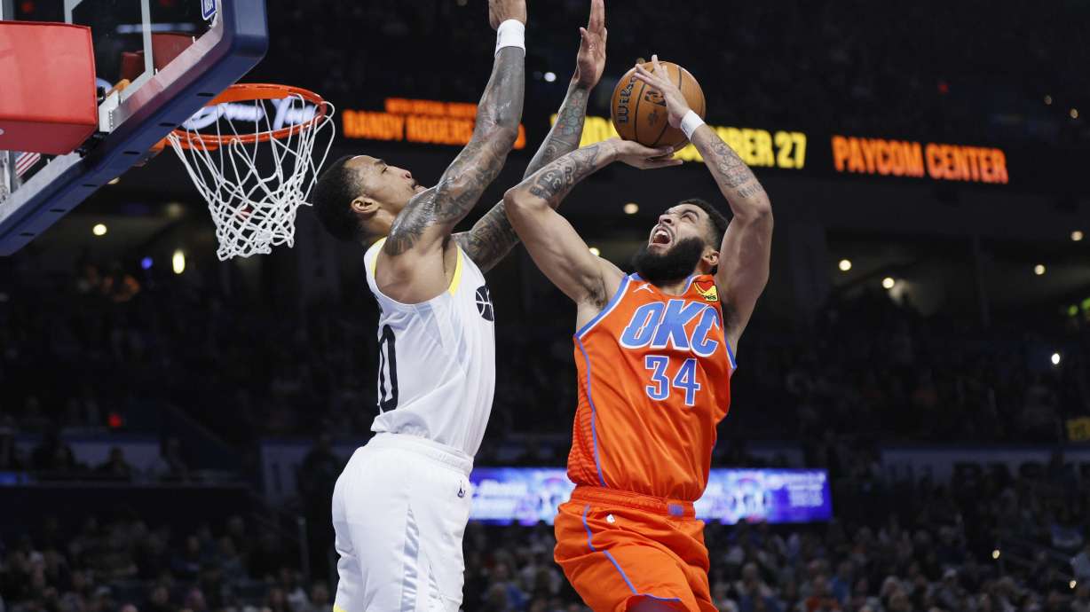 Oklahoma City Thunder forward Kenrich Williams (34) prepares to shoot against Utah Jazz forward John Collins, left, during the first half of an Emirates NBA Cup basketball game, Tuesday, Dec. 3, 2024, in Oklahoma City.