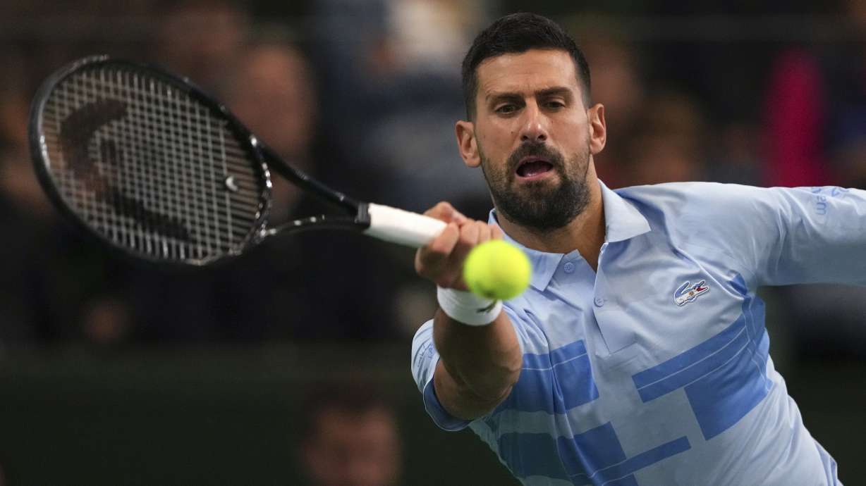 Serbia's Novak Djokovic returns the ball to Argentina's Juan Martin Del Potro during an exhibition tennis match in Buenos Aires, Argentina, Sunday, Dec. 1, 2024.