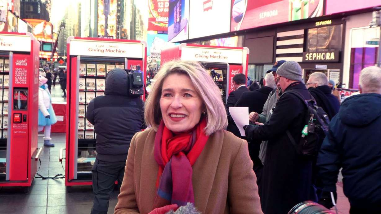 President Camille N. Johnson, general president of the Relief Society of The Church of Jesus Christ of Latter-day Saints, speaks to the media at the Giving Machines press event at Times Square in New York City on Monday.