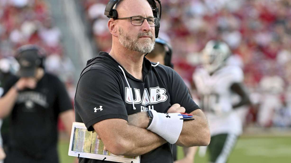 FILE - UAB coach Trent Dilfer watches during the second half of an NCAA college football game against Arkansas, Saturday, Sept. 14, 2024, in Fayetteville, Ark.