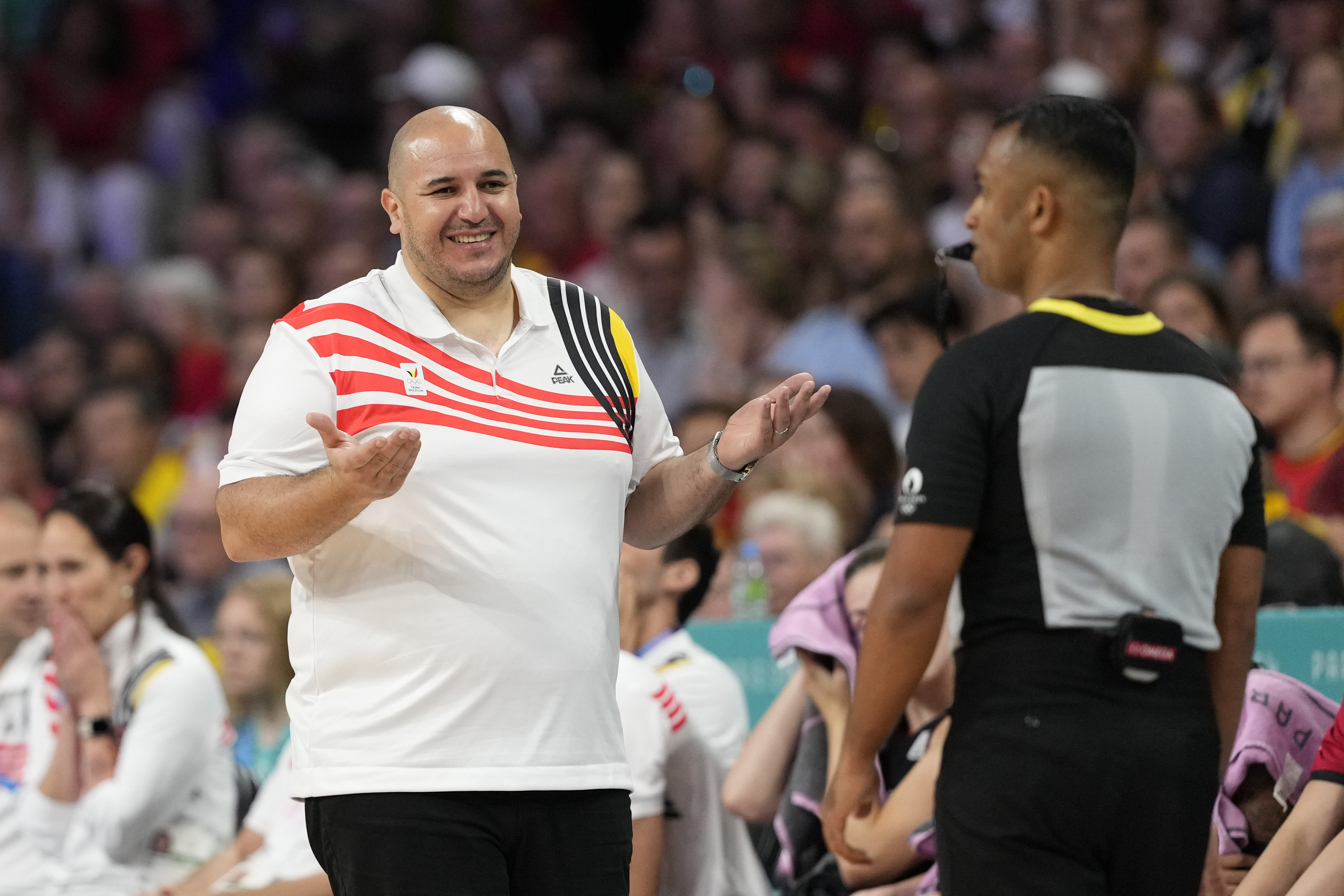 FILE - Belgium head coach Rachid Meziane questions an official in a women's basketball game at the 2024 Summer Olympics, Monday, July 29, 2024, in Villeneuve-d'Ascq, France.
