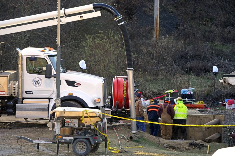 Rescue workers continue to search, Wednesday for Elizabeth Pollard, who is believed to have disappeared in a sinkhole while looking for her cat, in Marguerite, Pa.