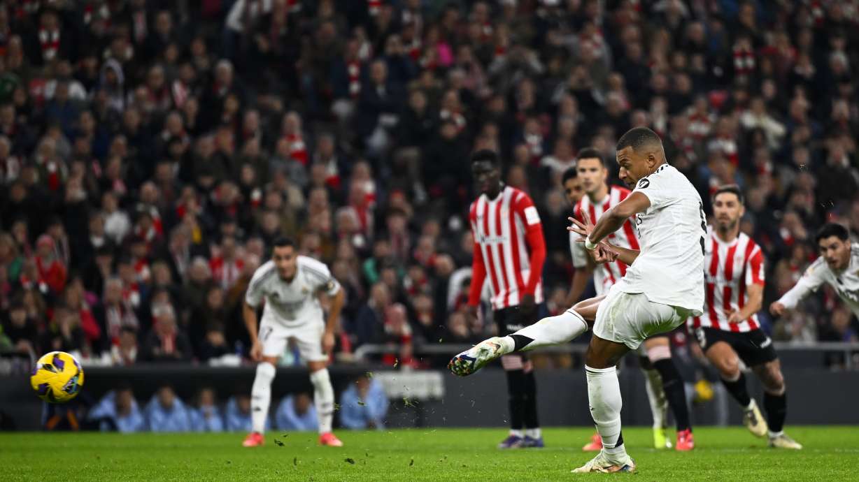 Real Madrid's Kylian Mbappe fails to score a penalty during the Spanish La Liga soccer match between Athletic Bilbao and Real Madrid at the San Mames stadium in Bilbao, Spain, Wednesday, Dec. 4, 2024.