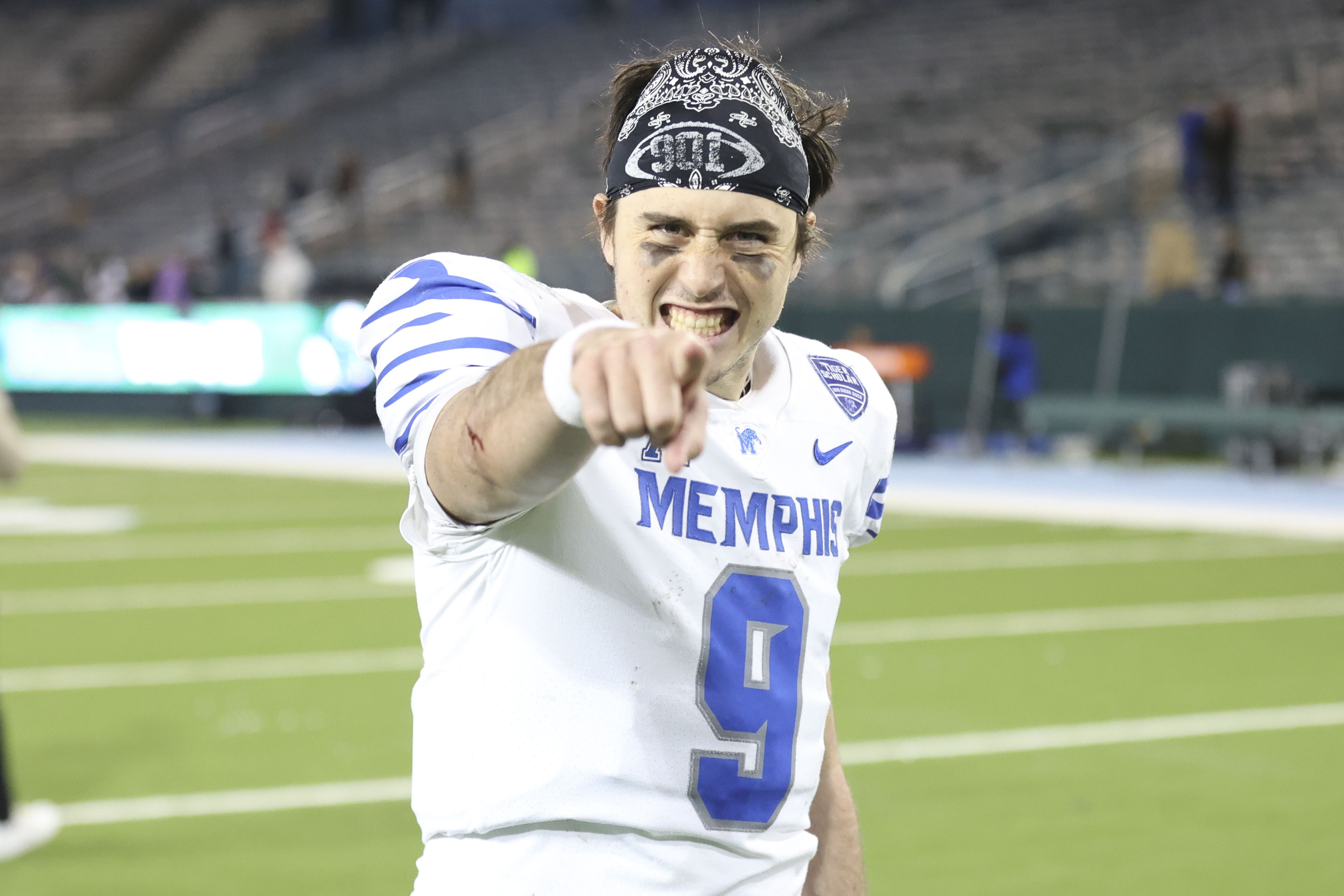 Memphis quarterback Seth Henigan (9) celebrates his team's 34-24 victory over Tulane in the second half of an NCAA college football game in New Orleans, Thursday, Nov. 28, 2024.