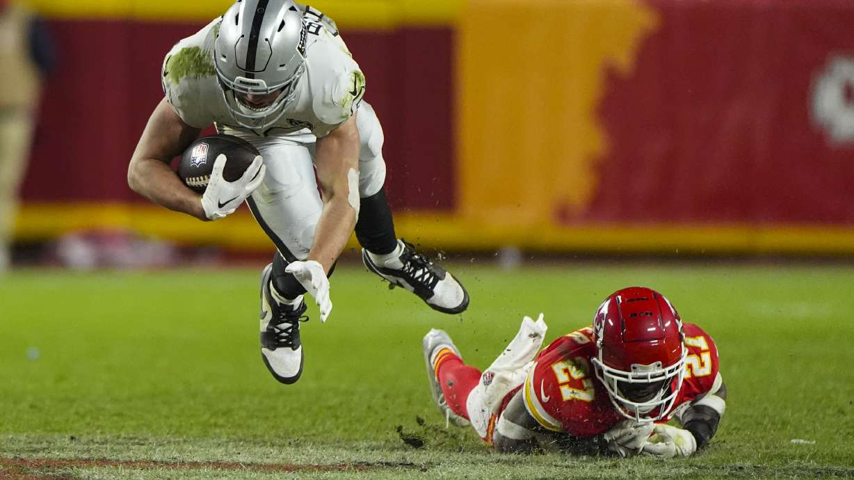 Las Vegas Raiders tight end Brock Bowers (89) is tackled by Kansas City Chiefs safety Chamarri Conner (27) during the second half of an NFL football game in Kansas City, Mo., Friday, Nov. 29, 2024.