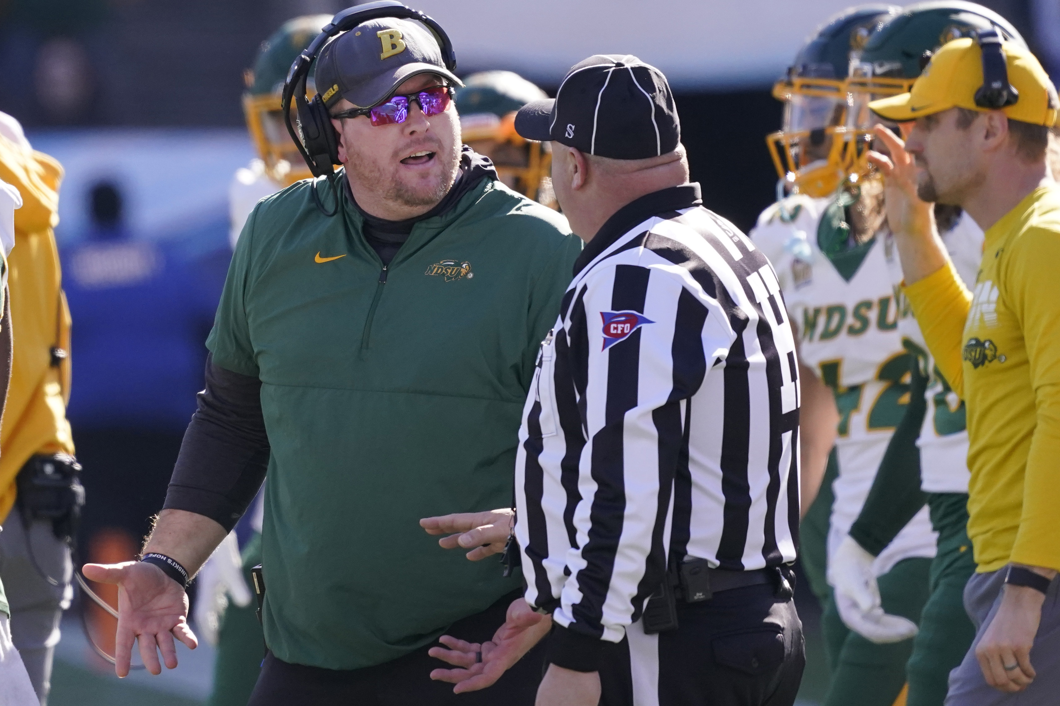FILE - North Dakota State head coach Matt Entz, left, speaks to an official during the first half of the FCS Championship NCAA college football game against the South Dakota State, Jan. 8, 2023, in Frisco, Texas. 