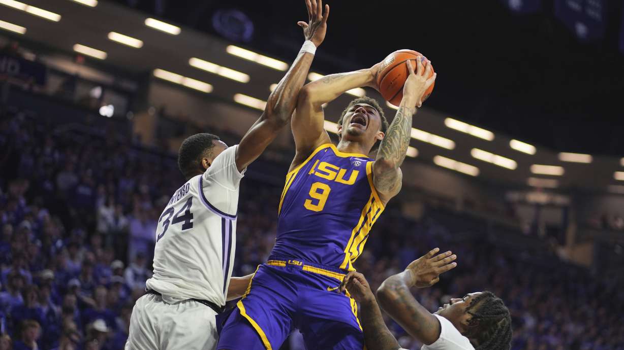 LSU forward Jalen Reed (9) shoots under pressure from Kansas State center Ugonna Onyenso (34) during the first half of an NCAA college basketball game Thursday, Nov. 14, 2024, in Manhattan, Kan.