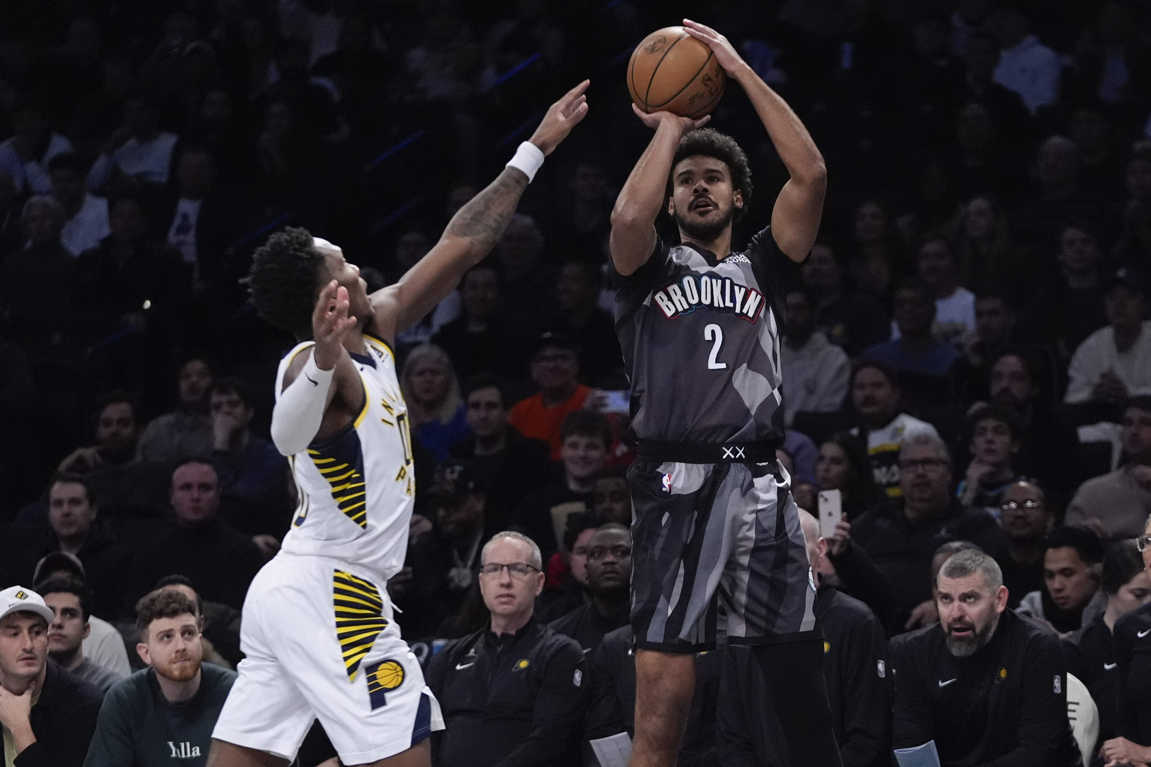 Brooklyn Nets' Cameron Johnson (2) shoots over Indiana Pacers' Bennedict Mathurin during the first half of an NBA basketball game, Wednesday, Dec. 4, 2024, in New York.