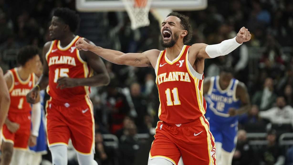 Atlanta Hawks' Trae Young (11) reacts as he walks to the bench during a timeout during the second half of an NBA basketball game against the Milwaukee Bucks, Wednesday, Dec. 4, 2024, in Milwaukee.