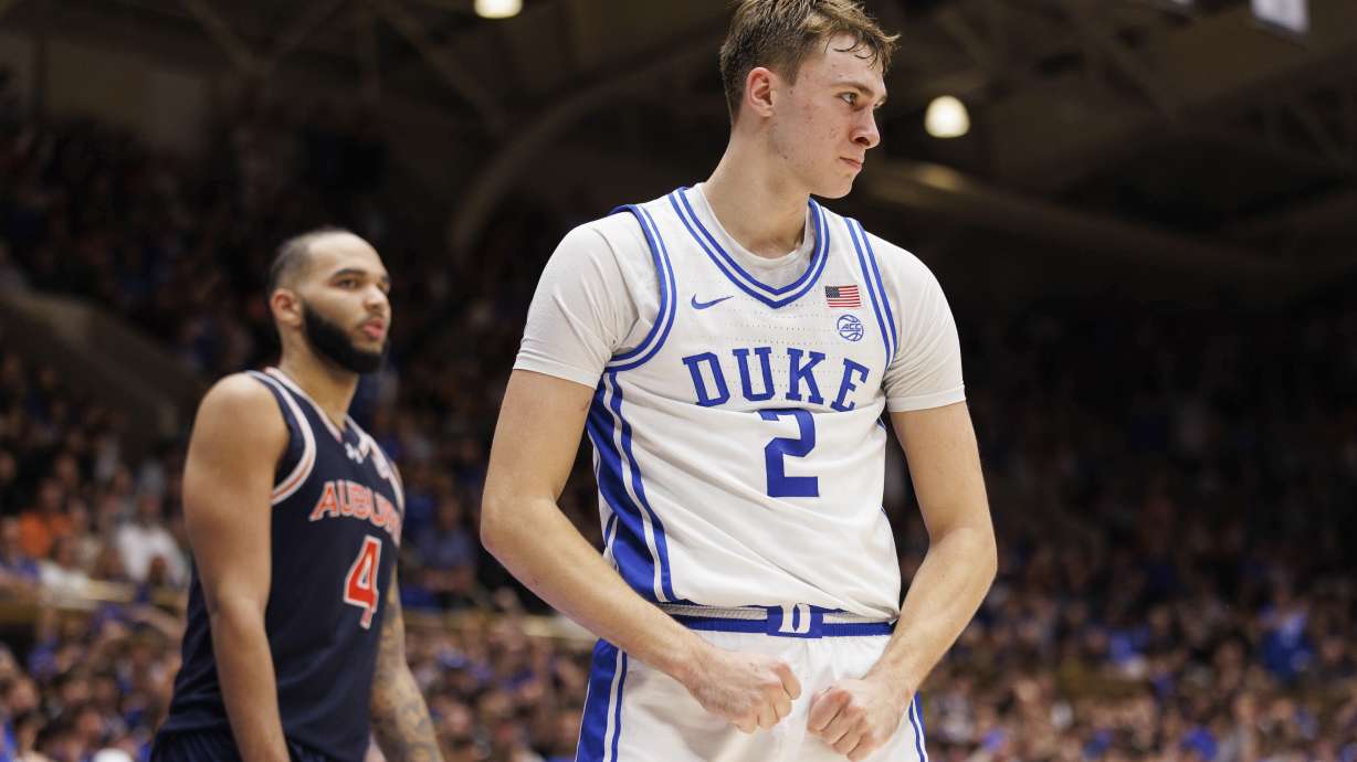 Duke's Cooper Flagg (2) reacts after scoring a basket ahead of Auburn's Johni Broome (4) during the second half of an NCAA college basketball game in Durham, N.C., Wednesday, Dec. 4, 2024.