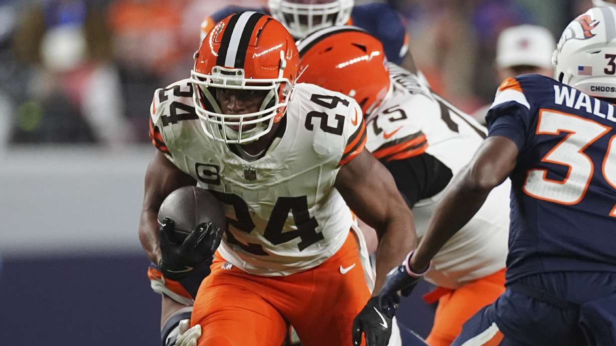 Cleveland Browns running back Nick Chubb (24) rushes during the first half of an NFL football game against the Denver Broncos, Monday, Dec. 2, 2024, in Denver.