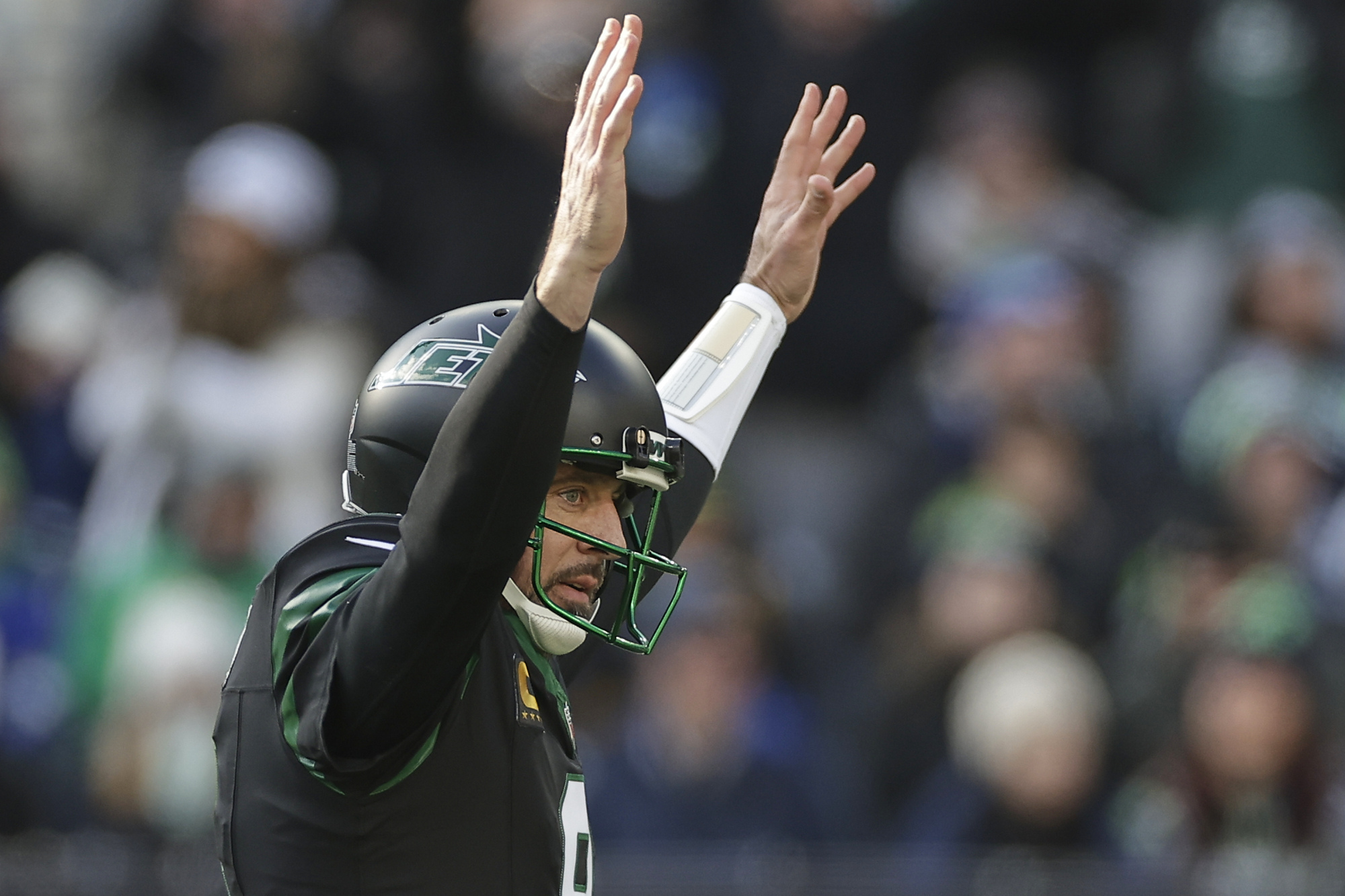 New York Jets quarterback Aaron Rodgers (8) reacts after throwing a touchdown pass against the Seattle Seahawks during the first quarter of an NFL football game, Sunday, Dec. 1, 2024, in East Rutherford, N.J.